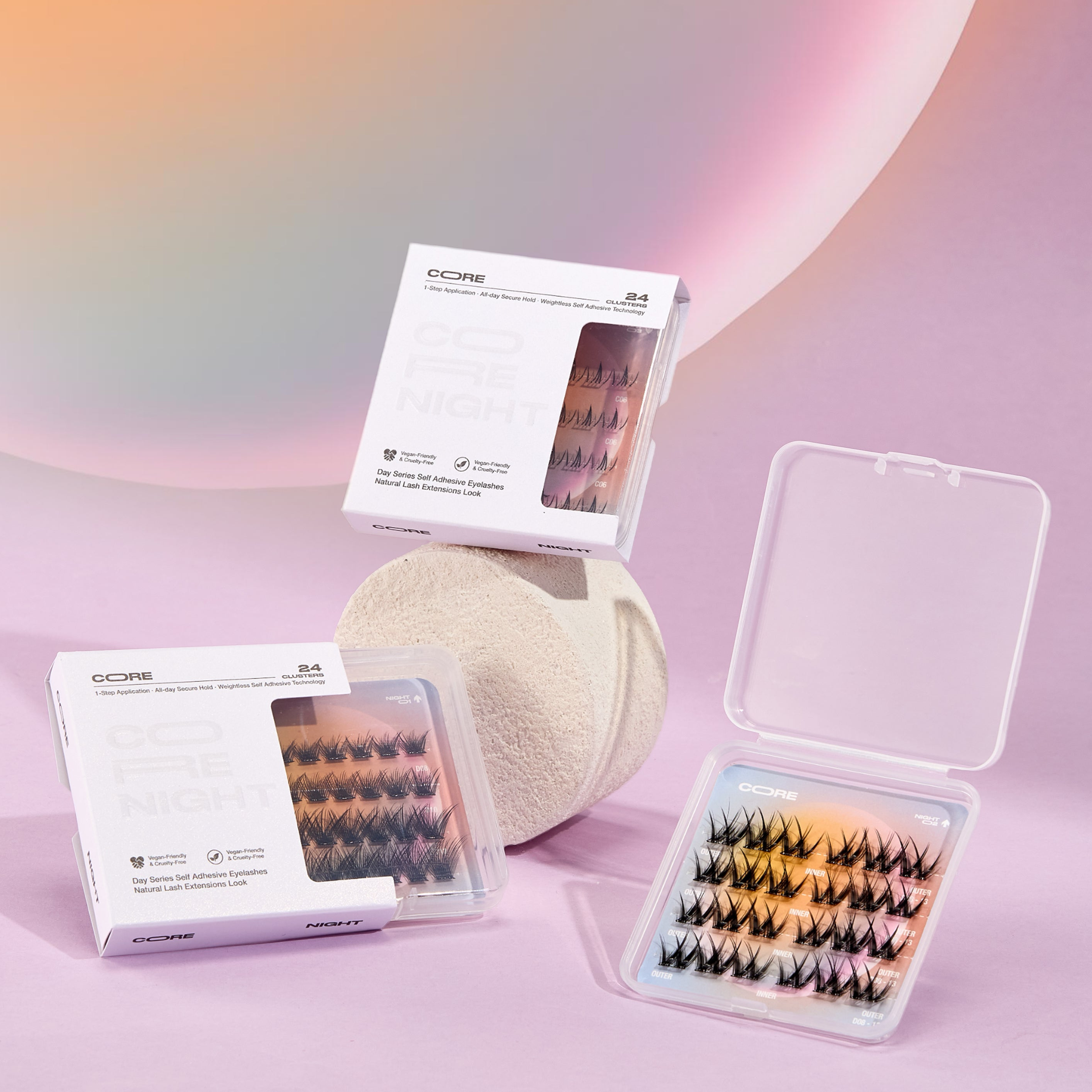 CoreLash Night Set packaging on a pink background, includes three bestselling self-adhesive lash clusters for wispy, spike, and lower-lash glam looks. Easy to apply, no glue needed. 