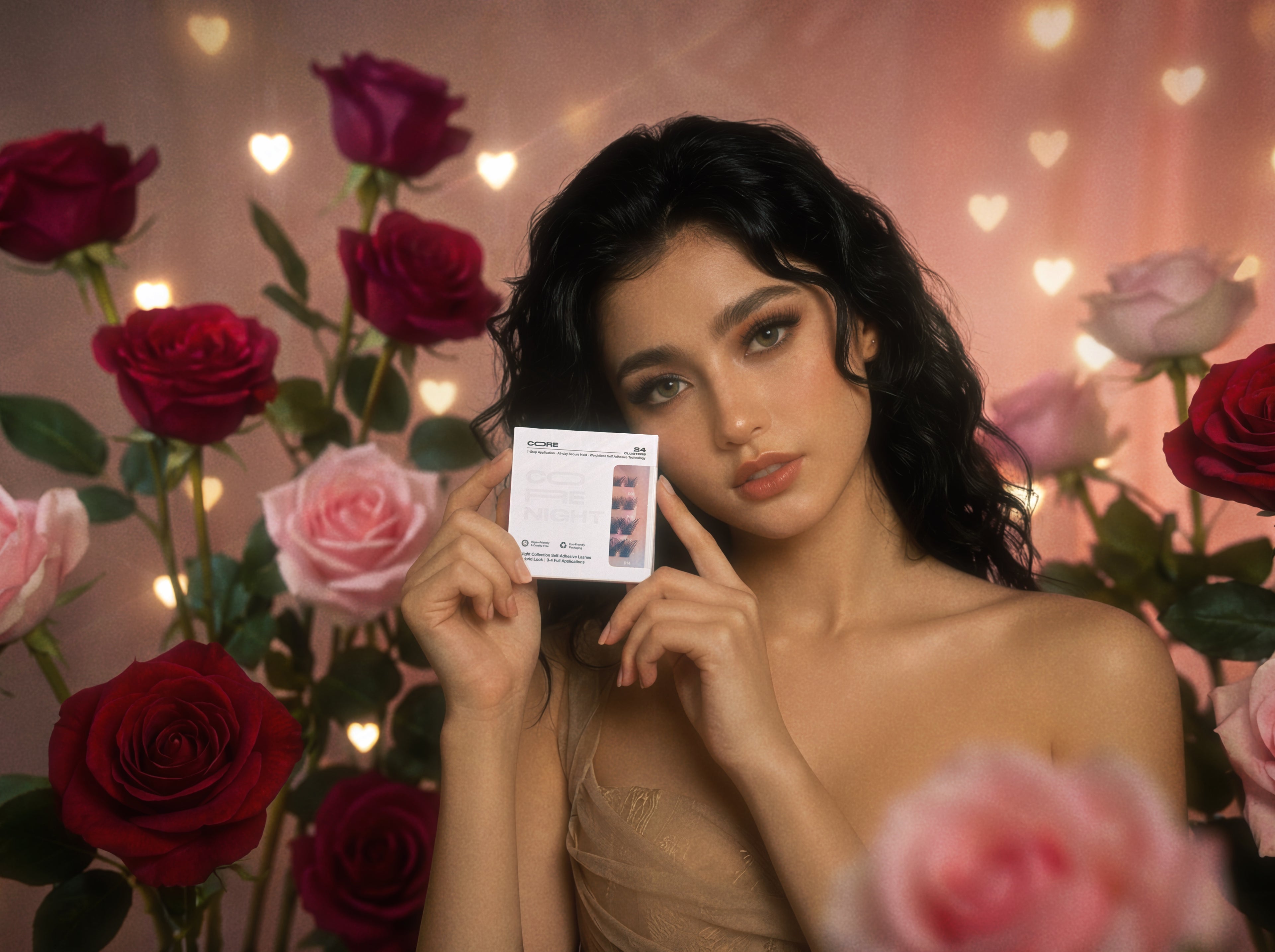 A woman holds CoreLash Night 001 self-adhesive lashes, DIY wispy style, posed in front of flowers.